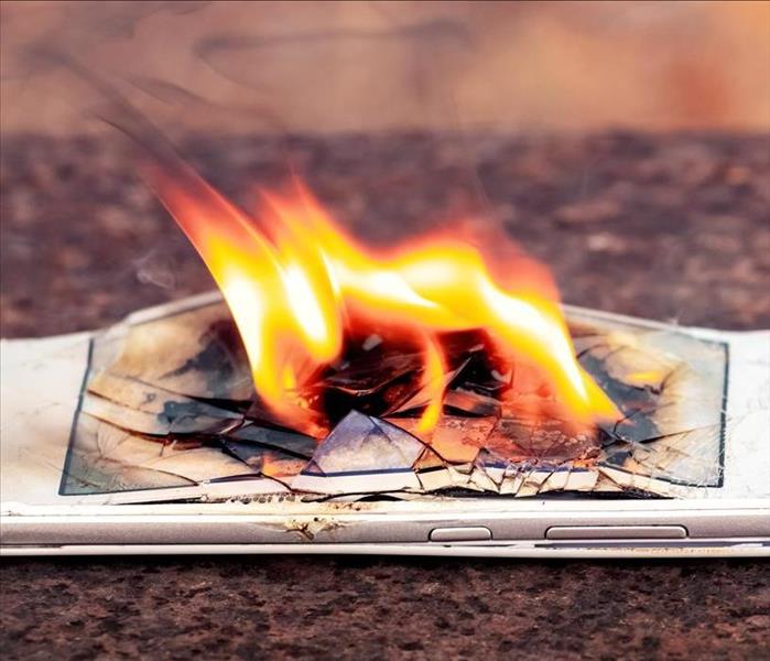 Flames rising from a phone.